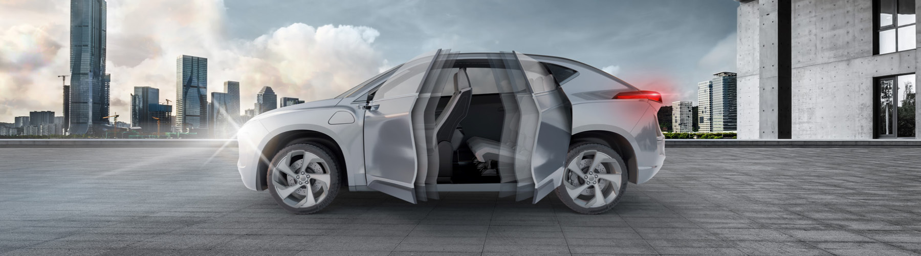 Grey vehicle in a parking garage with front and rear doors opening