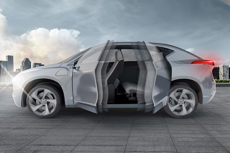 Grey vehicle in a parking garage with front and rear doors opening