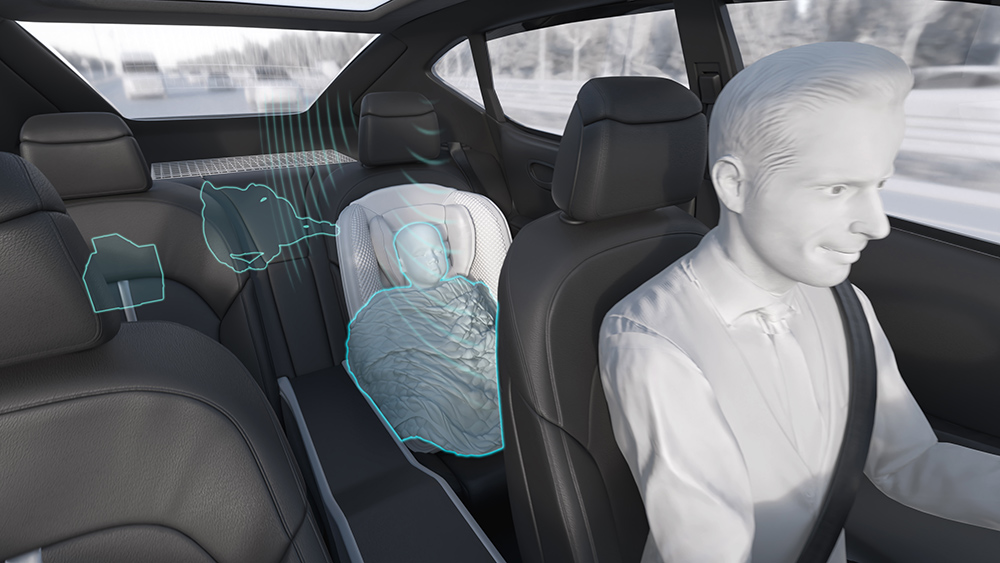 Animation of vehicle showing occupant monitoring radar indicating passenger and pet in backseat of vehicle