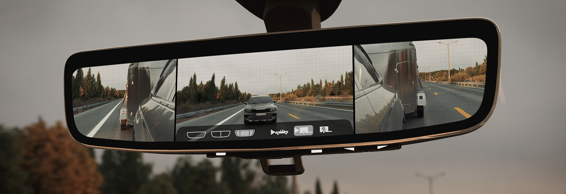 ClearView interior mirror switching to a full-size display showing an unobstructed view from the rear-mounted camera and the trailer being pulled by the vehicle.