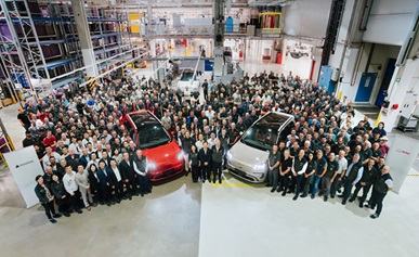 Group of people celebrating the start of production in a Magna facility in Graz, Austria