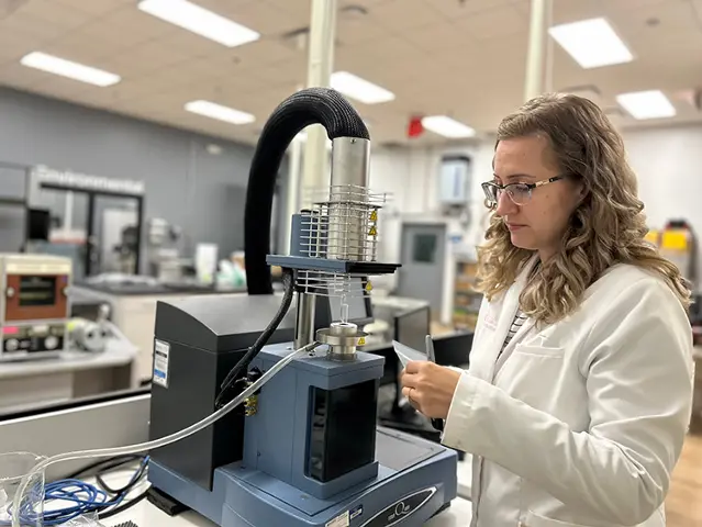 Scientist operating advanced equipment in a laboratory