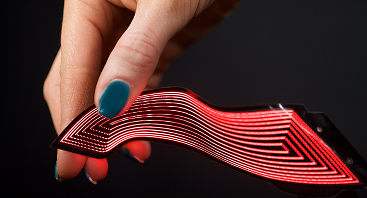 Hand holding a piece of FlecsForm material