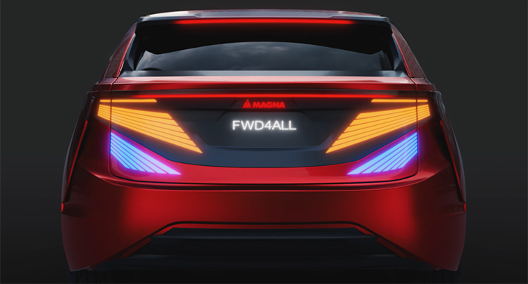 Rear view of a red vehicle with the Magna logo and tagline illuminating using breakthrough lighting